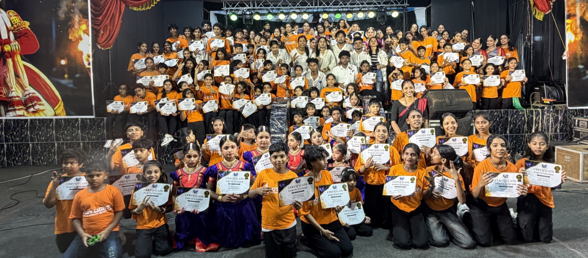Footlights students on stage with participation certificates at the annual showcase